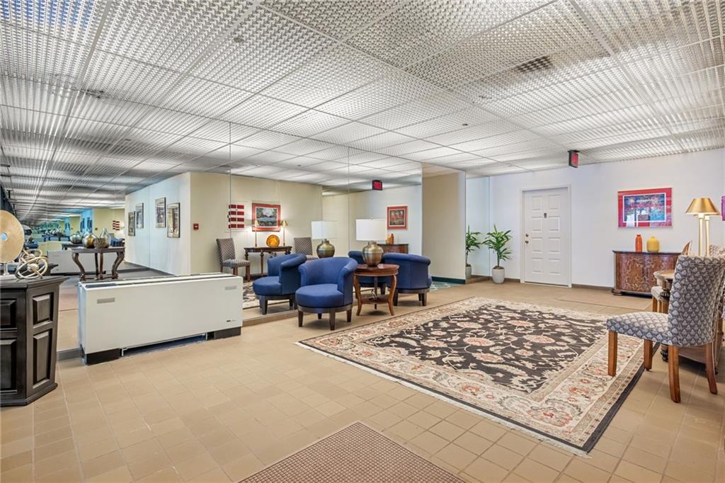 750 Washington Road, Unit 409 Pittsburgh, PA 15228 - Photo 8 of 21 a living room with furniture rug and wooden floor