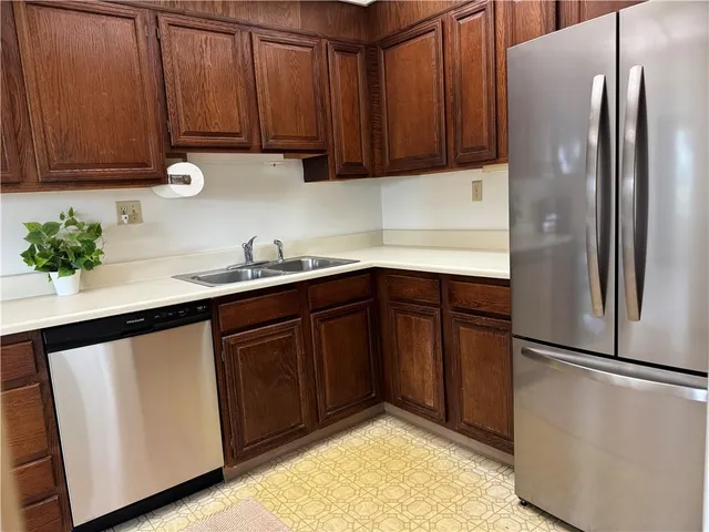 a kitchen with a sink stove and microwave