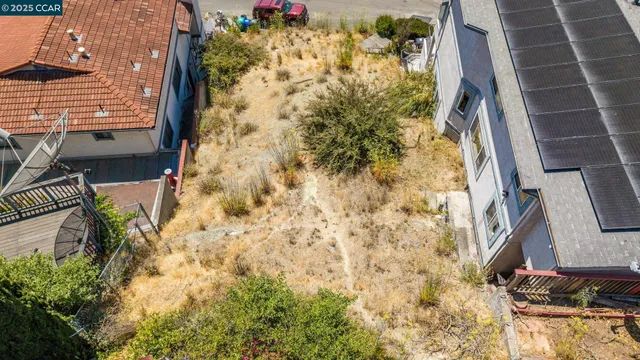 a aerial view of a house with large trees