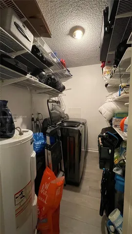 a living room with a couch and a stove top oven
