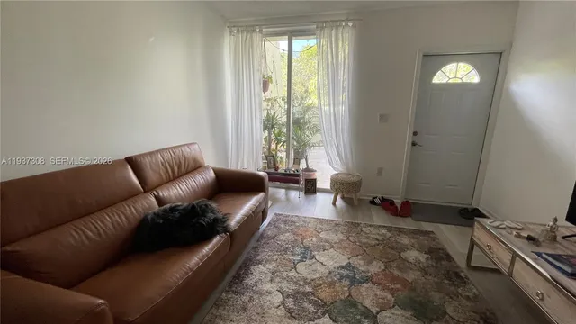 a living room with furniture and a gate
