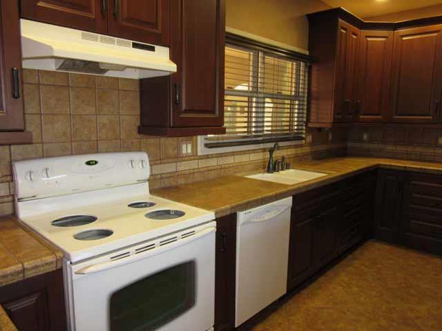16648-34 Alpine Road Lodi, CA 95240 - Photo 17 of 29 a kitchen that has a sink a stove and a microwave