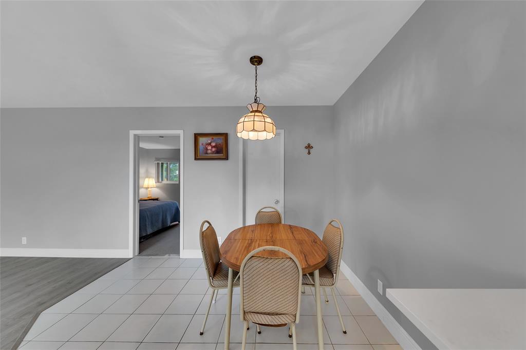 11 Southwest 4th Avenue, Unit 10 Boca Raton, FL 33432 - Photo 12 of 32 a dining room with furniture and window