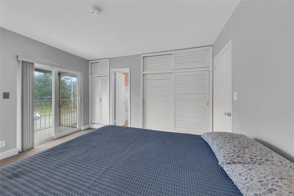 11 Southwest 4th Avenue, Unit 10 Boca Raton, FL 33432 - Photo 21 of 32 a view of a room with wooden floor and windows