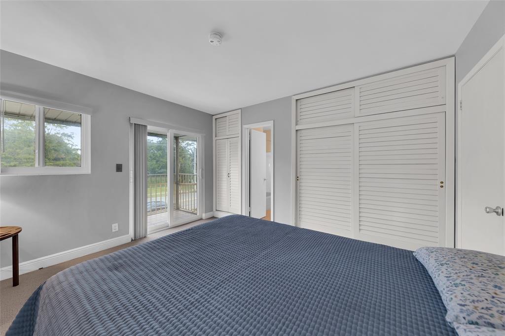 11 Southwest 4th Avenue, Unit 10 Boca Raton, FL 33432 - Photo 22 of 32 a view of a room with a large bed