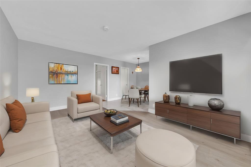 11 Southwest 4th Avenue, Unit 10 Boca Raton, FL 33432 - Photo 5 of 32 a living room with furniture and a flat screen tv