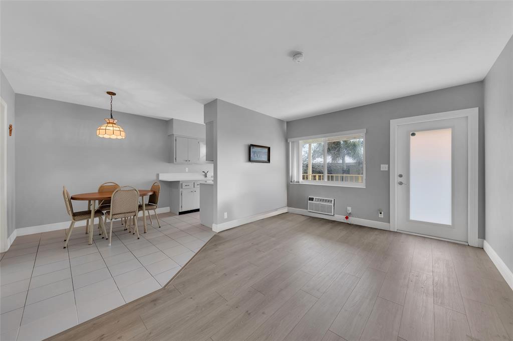 11 Southwest 4th Avenue, Unit 10 Boca Raton, FL 33432 - Photo 7 of 32 an empty room with furniture and a window