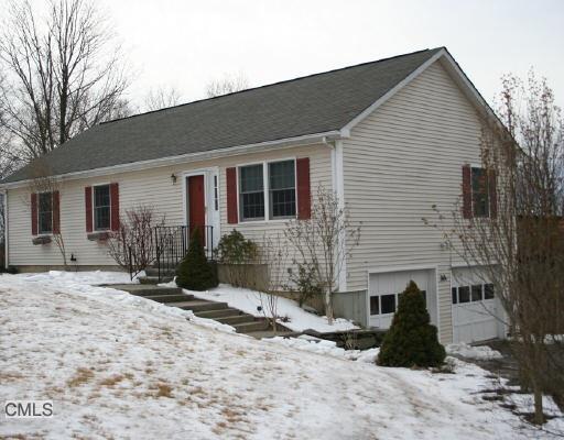 30 A Pocono Ridge Road Brookfield, CT 06804 - Photo 1 of 1 a front view of a house with a yard