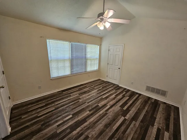 a view of an empty room and window