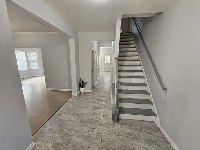 a view of a hallway view with staircase