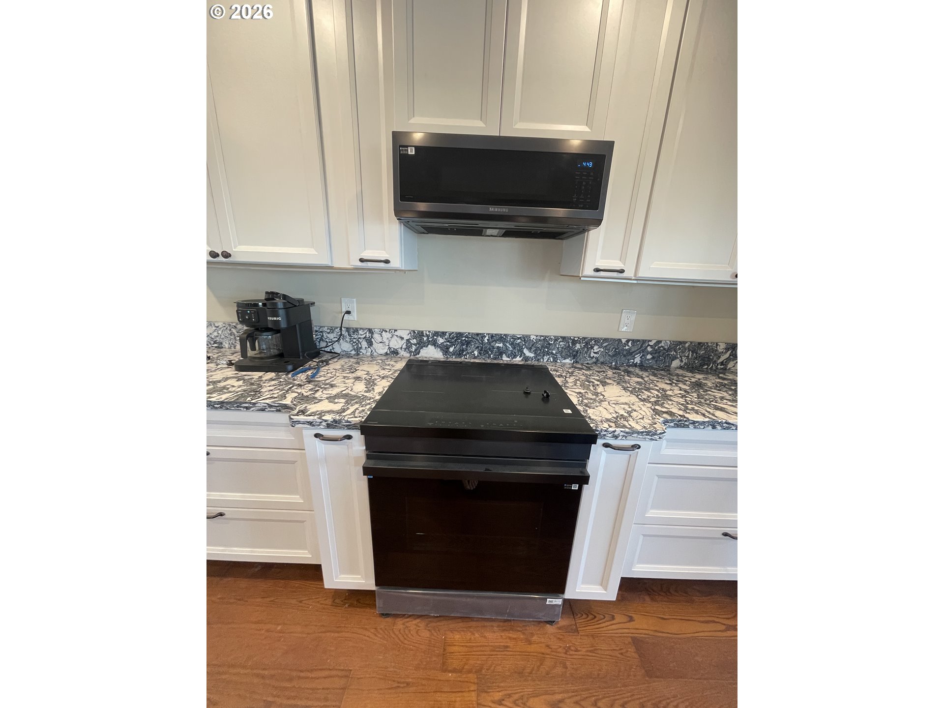 360 2nd Street Southeast Bandon, OR 97411 - Photo 12 of 28 a kitchen with a stove and a microwave