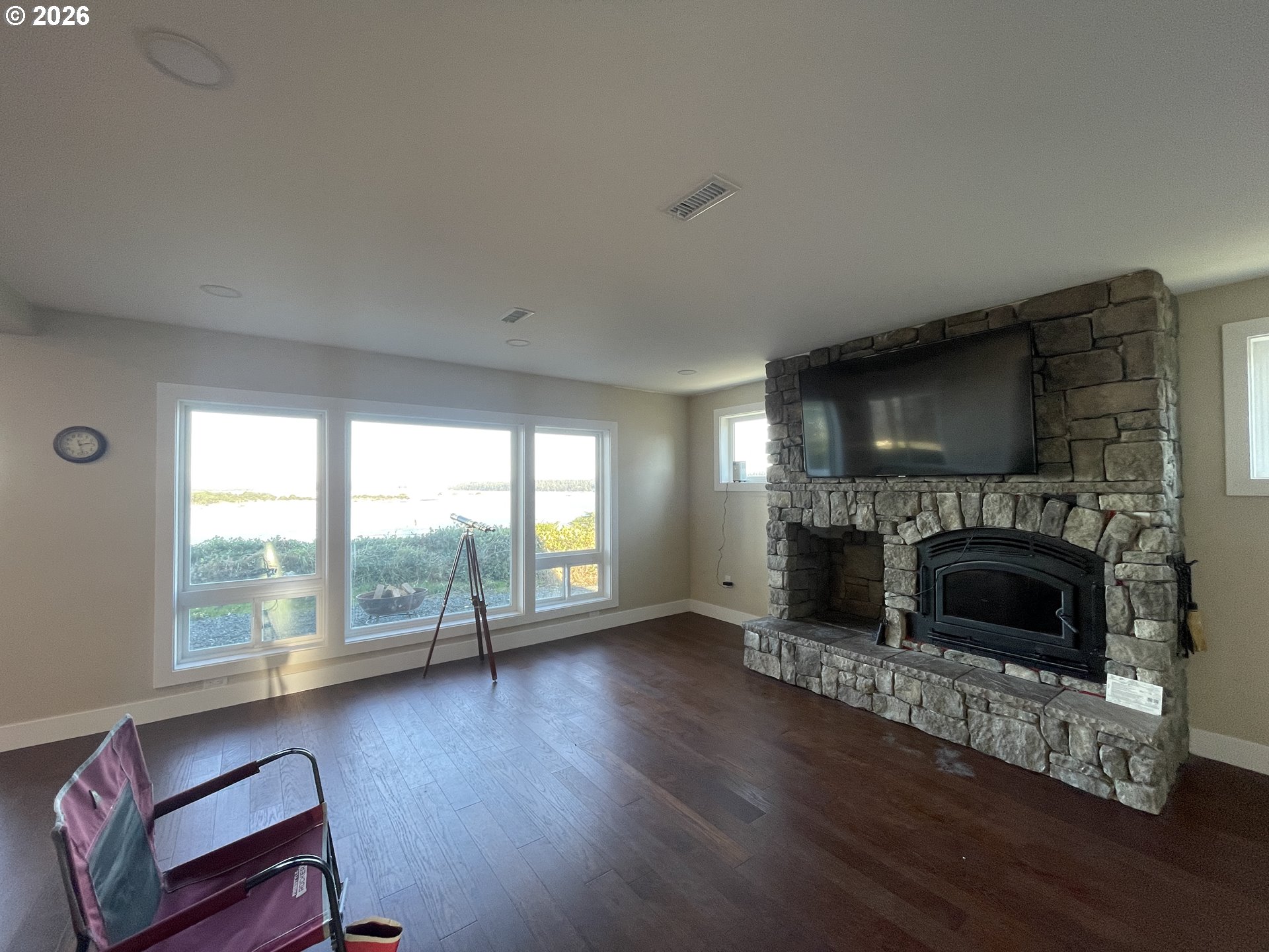 360 2nd Street Southeast Bandon, OR 97411 - Photo 14 of 28 a living room with furniture and a fireplace