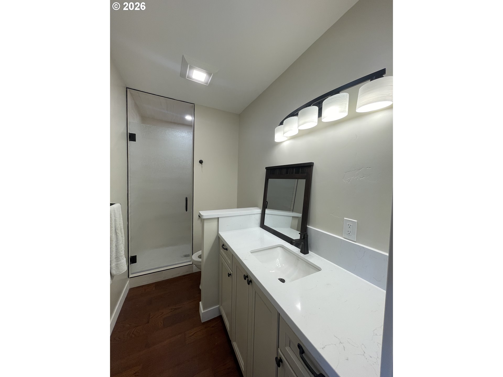 360 2nd Street Southeast Bandon, OR 97411 - Photo 16 of 28 a bathroom with a sink a toilet and mirror