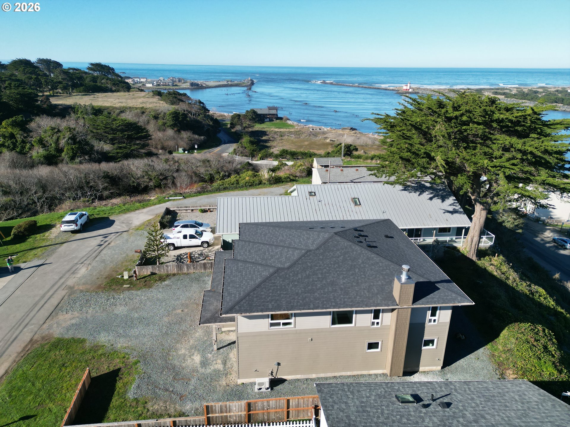 360 2nd Street Southeast Bandon, OR 97411 - Photo 5 of 28 an aerial view of a house with a garden