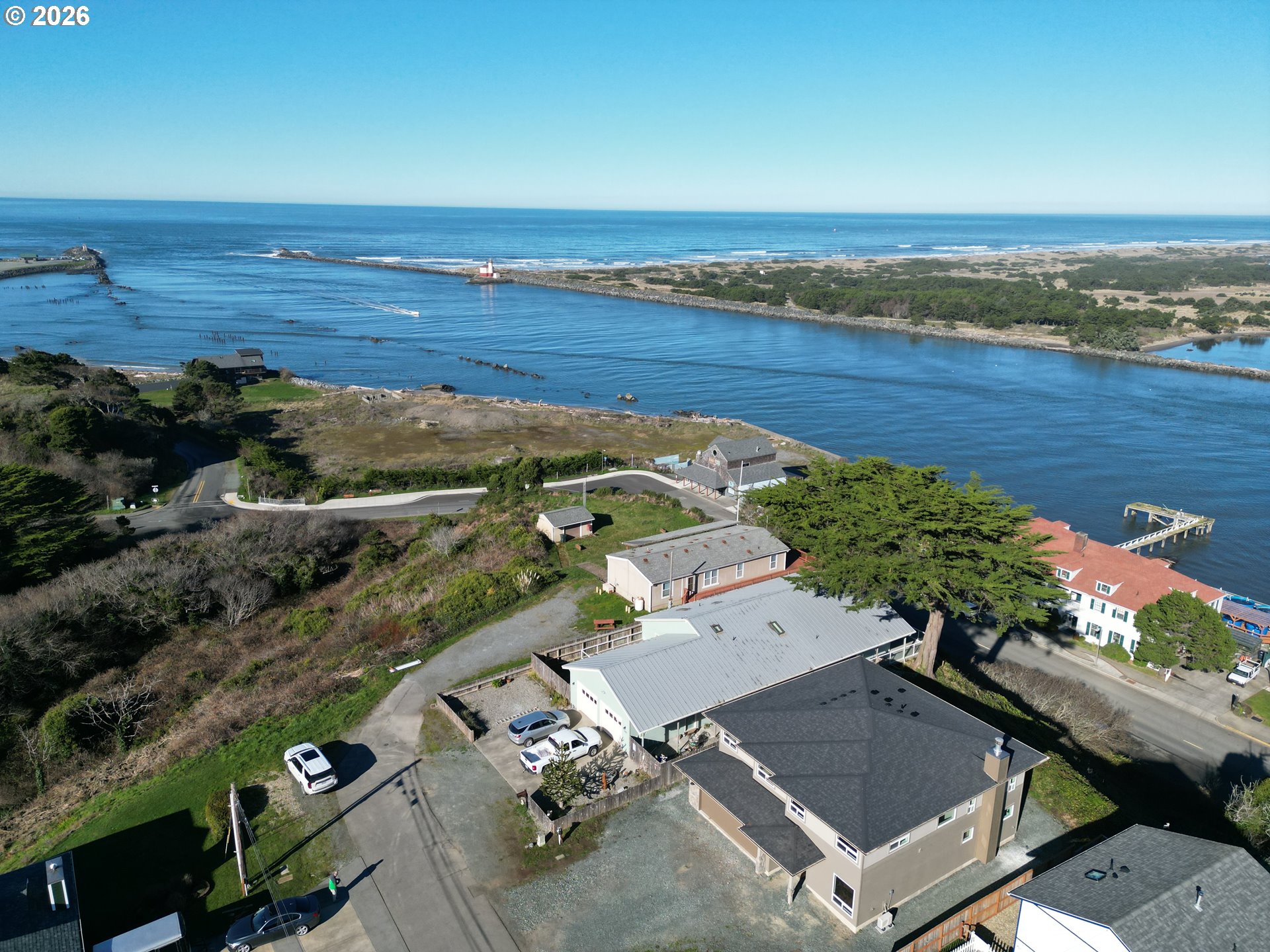 360 2nd Street Southeast Bandon, OR 97411 - Photo 9 of 28 an aerial view of multiple house with outdoor space