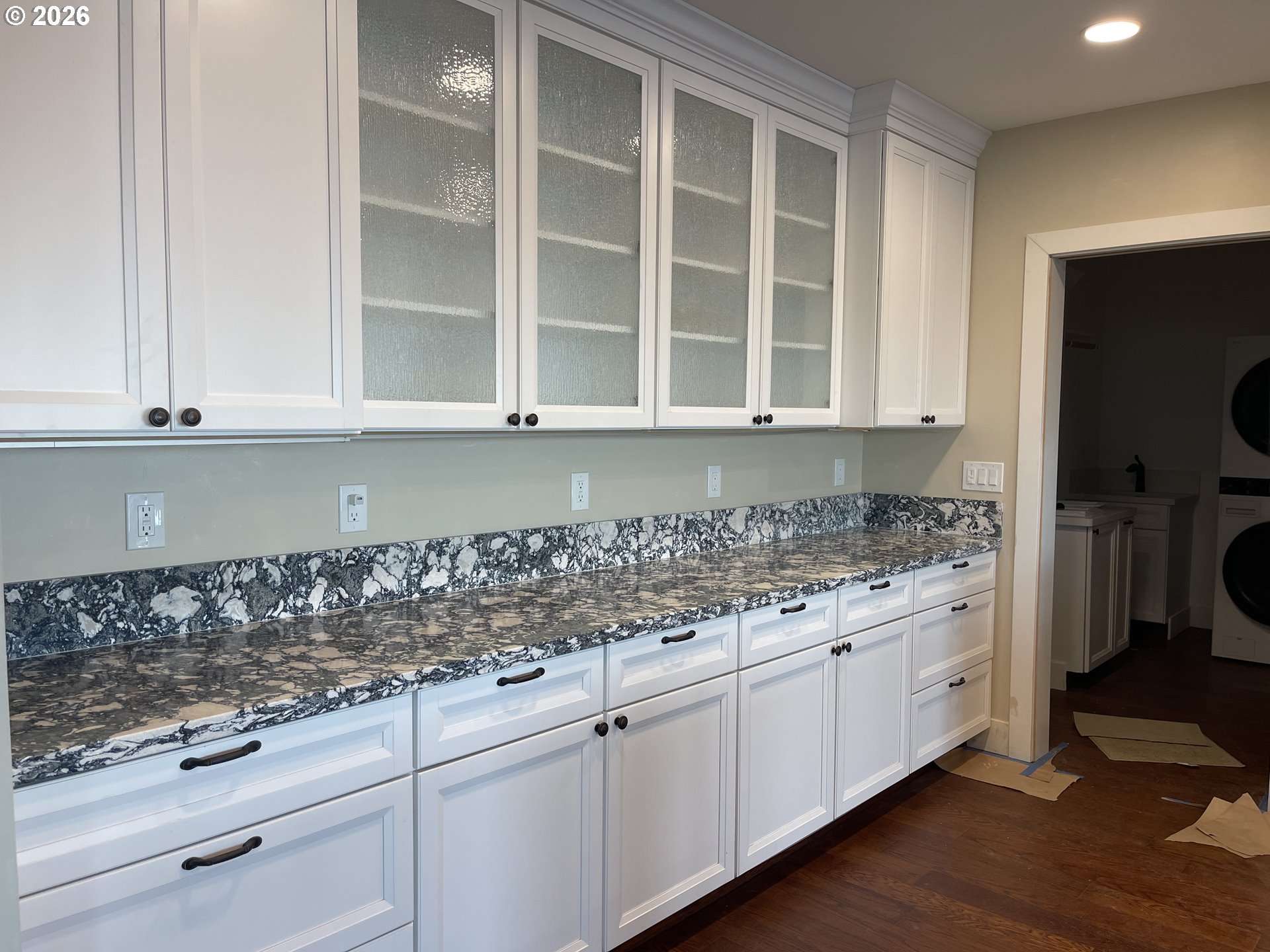 360 2nd Street Southeast Bandon, OR 97411 - Photo 10 of 28 a kitchen with stainless steel appliances granite countertop a sink and a white cabinets