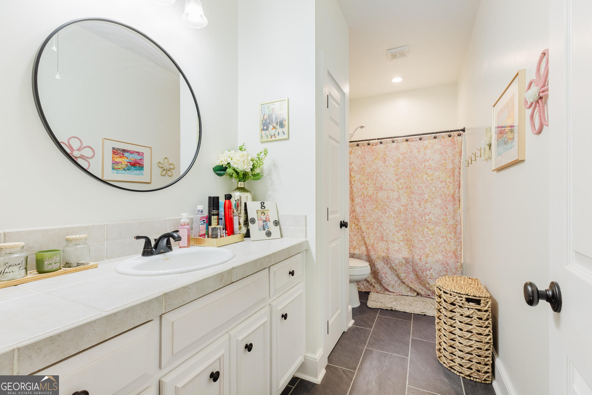 1859 Upper River Road Americus, GA 31709 - Photo 22 of 47 a bathroom with a sink mirror toilet and a shower