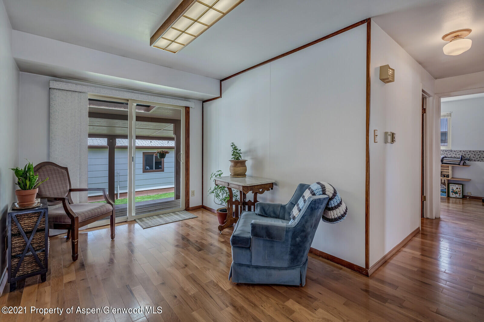 446 Elm Avenue Rifle, CO 81650 - Photo 11 of 28 a living room with furniture and a wooden floor