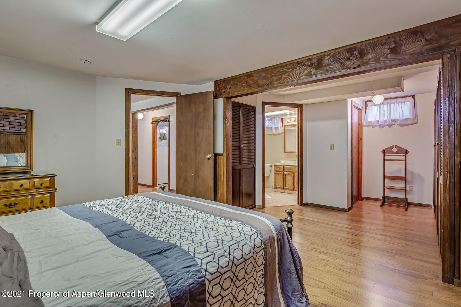 446 Elm Avenue Rifle, CO 81650 - Photo 17 of 28 a bedroom with a bed and a dresser