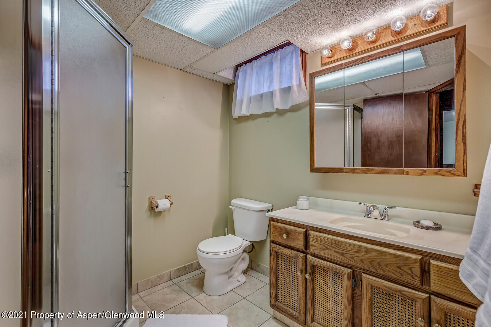 446 Elm Avenue Rifle, CO 81650 - Photo 18 of 28 a bathroom with a sink mirror vanity and toilet