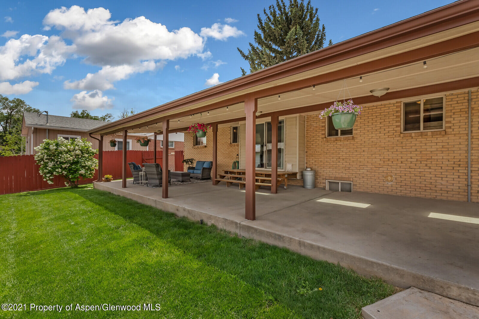 446 Elm Avenue Rifle, CO 81650 - Photo 2 of 28 a view of a patio with table and chairs and potted plants