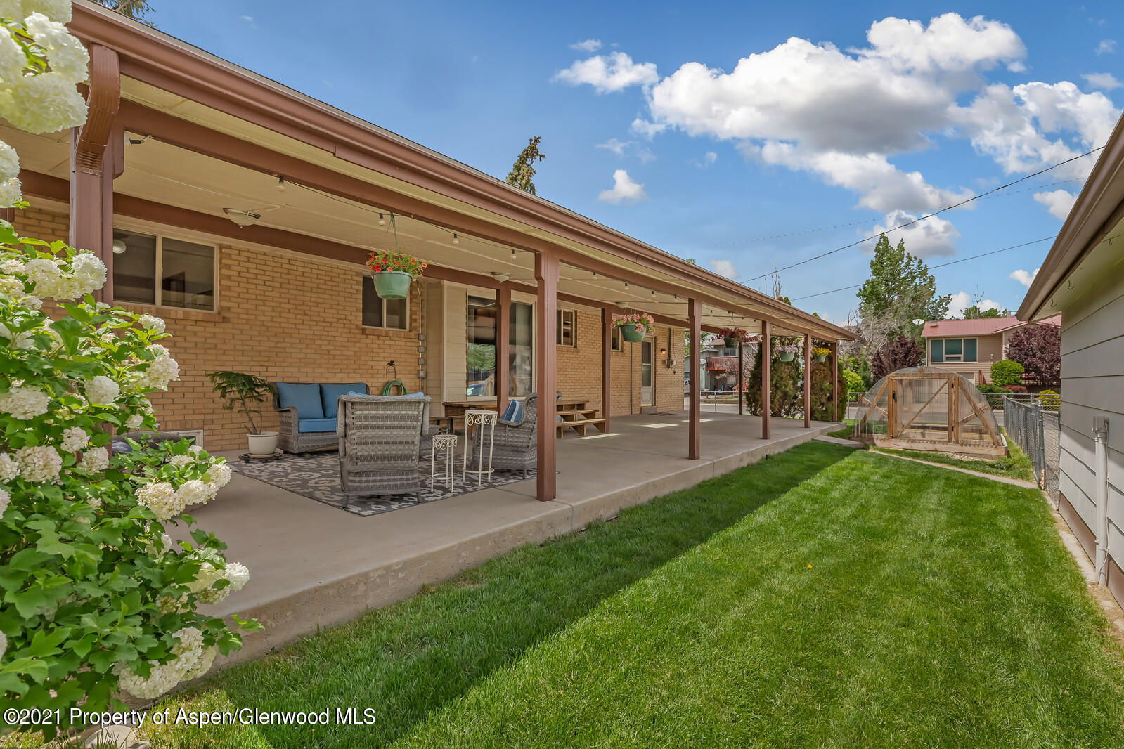 446 Elm Avenue Rifle, CO 81650 - Photo 25 of 28 a view of a porch with chairs and backyard