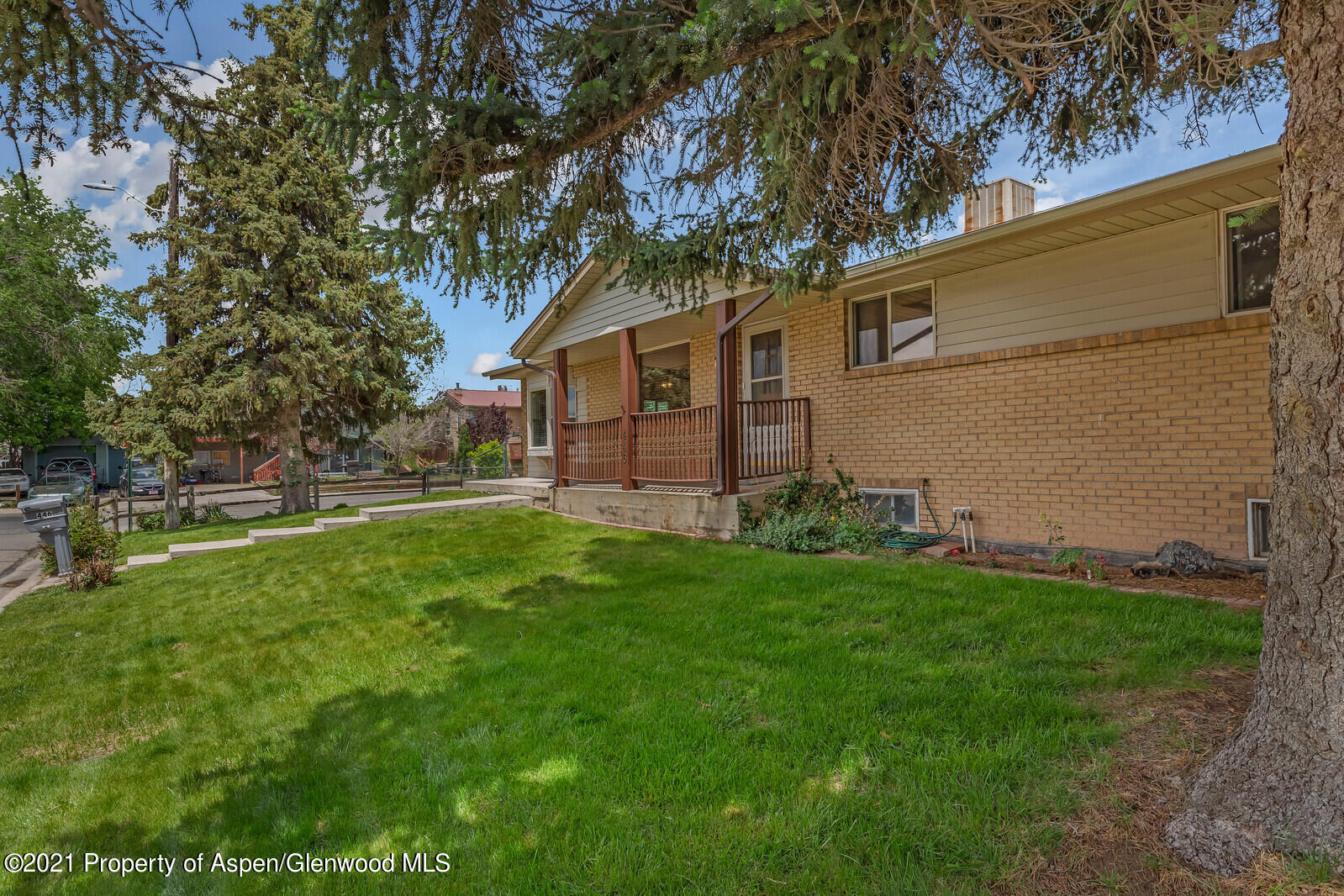 446 Elm Avenue Rifle, CO 81650 - Photo 27 of 28 a view of a backyard with a large tree