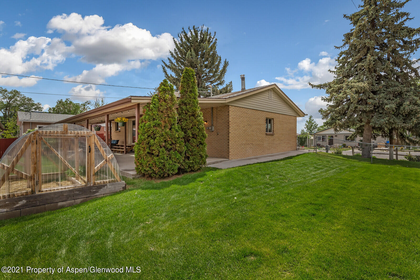 446 Elm Avenue Rifle, CO 81650 - Photo 28 of 28 a view of backyard with a garden and entertaining space