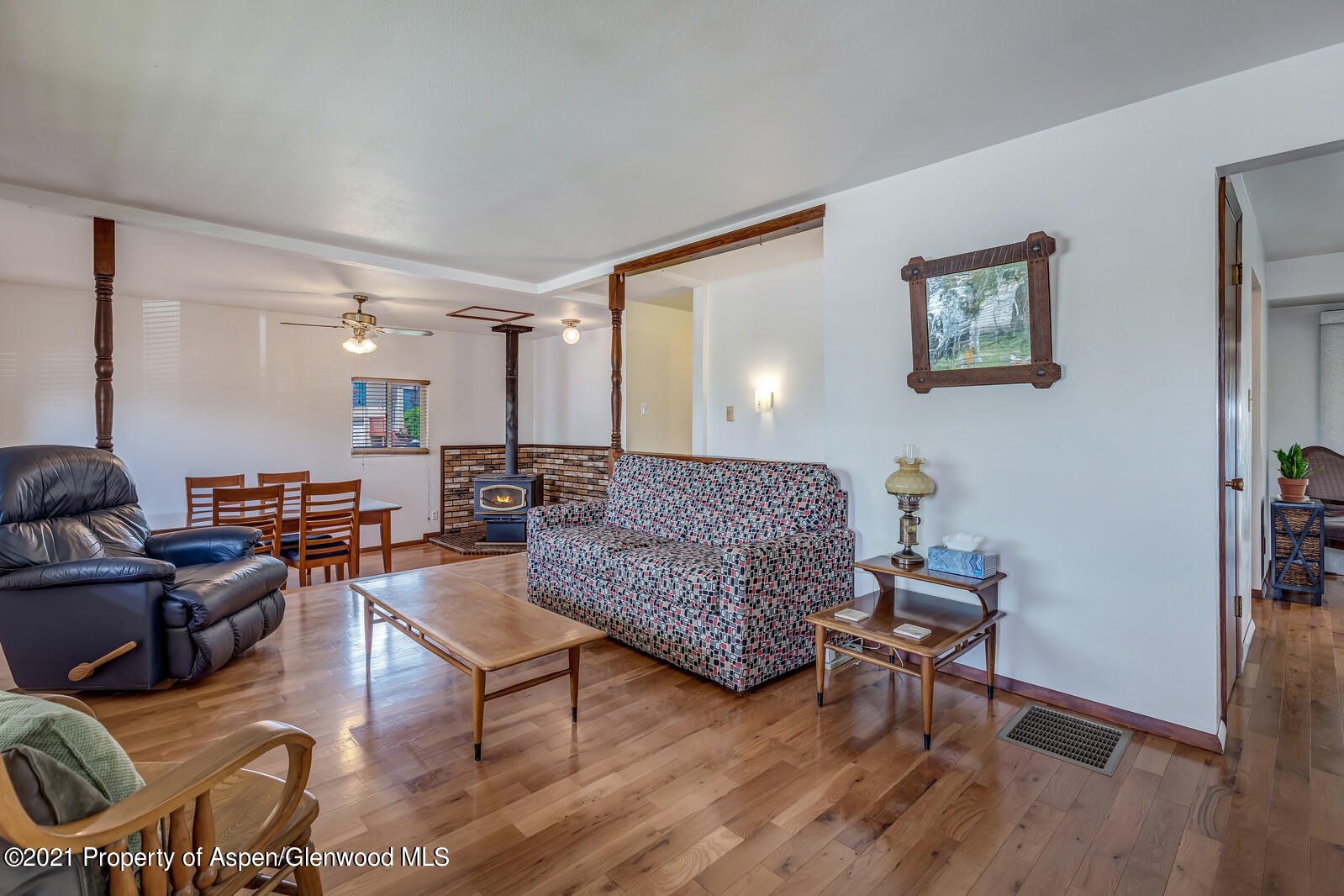 446 Elm Avenue Rifle, CO 81650 - Photo 4 of 28 a living room with furniture and a wooden floor