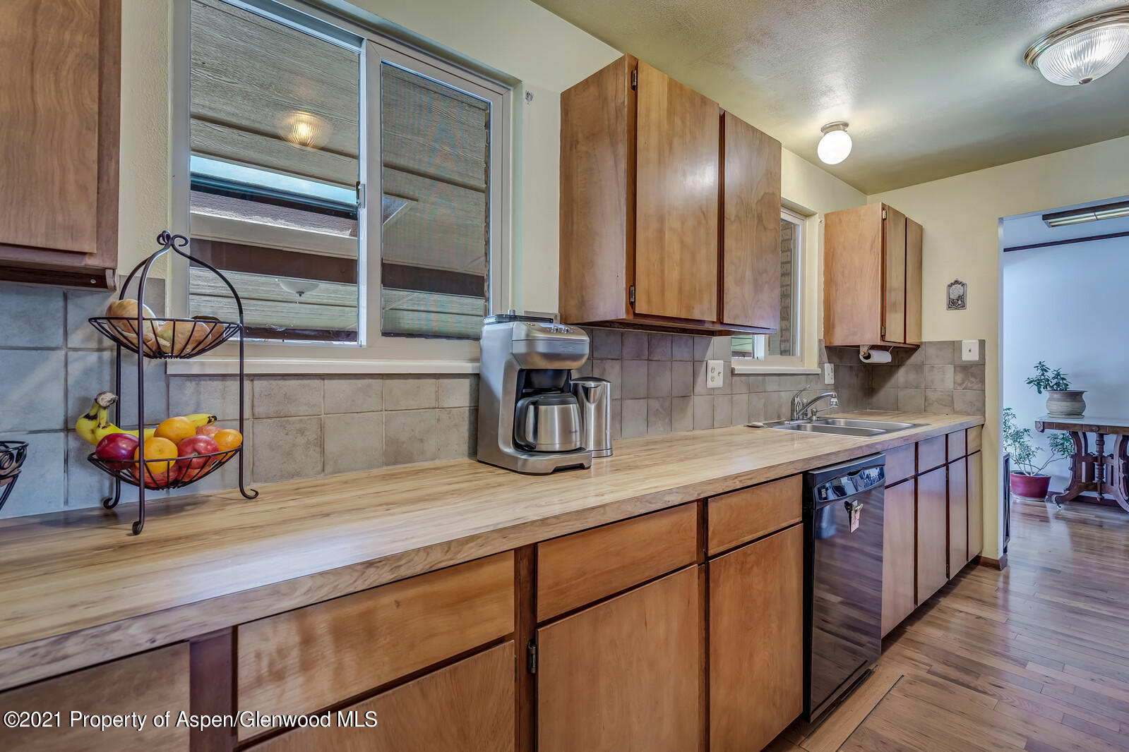 446 Elm Avenue Rifle, CO 81650 - Photo 6 of 28 a kitchen with stainless steel appliances a sink and cabinets