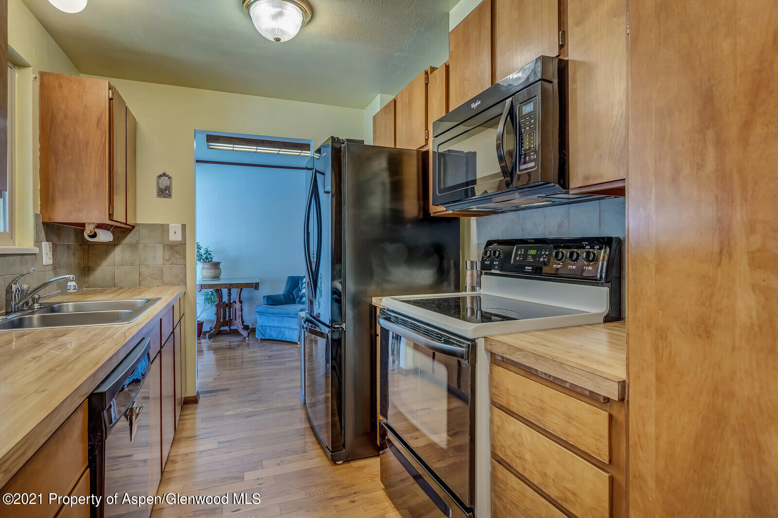 446 Elm Avenue Rifle, CO 81650 - Photo 7 of 28 a kitchen with a stove and a refrigerator