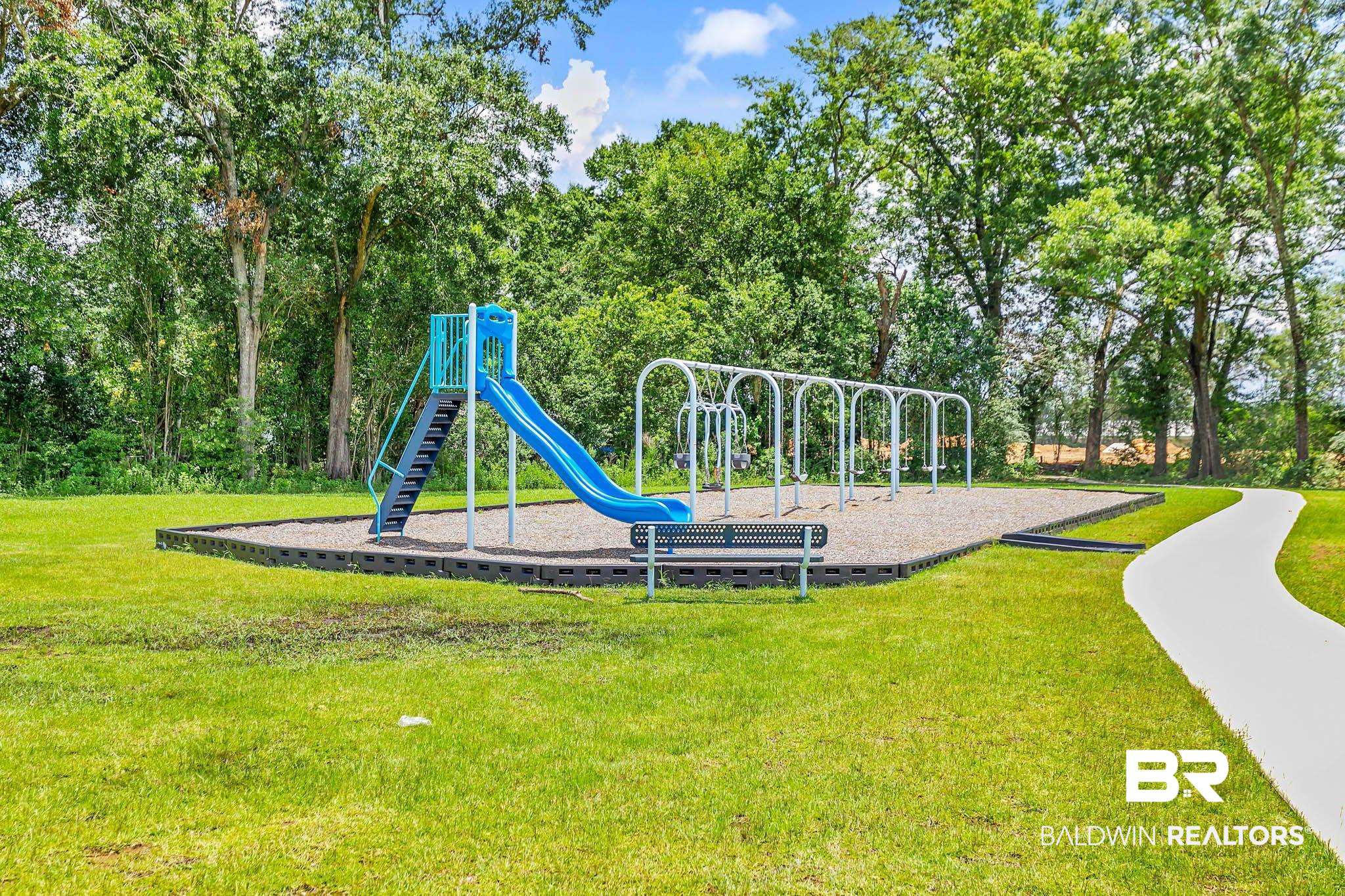 17217 REFLECTION Street Loxley, AL 36551 - Photo 47 of 83 Community play area featuring a yard and view of scattered trees