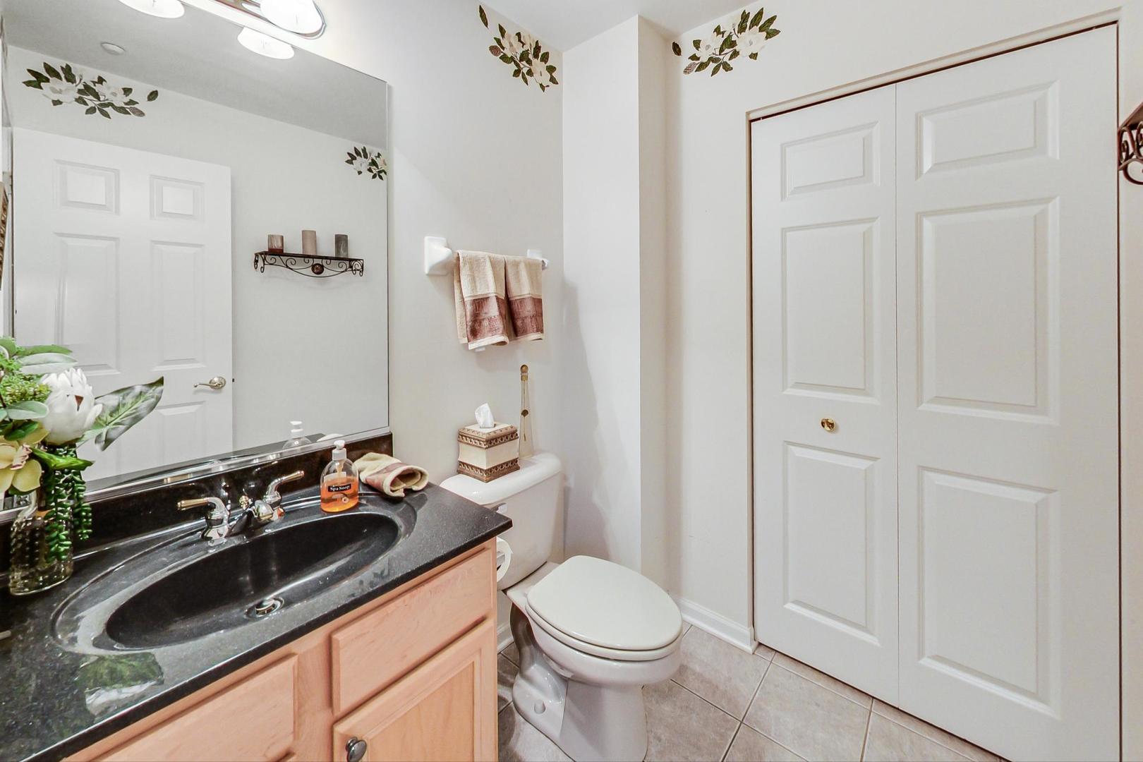 8052 Orchard Commons West Long Grove, IL 60060 - Photo 15 of 32 a bathroom with a sink and a toilet