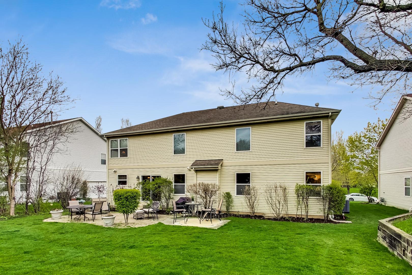 8052 Orchard Commons West Long Grove, IL 60060 - Photo 24 of 32 a view of a house with a yard
