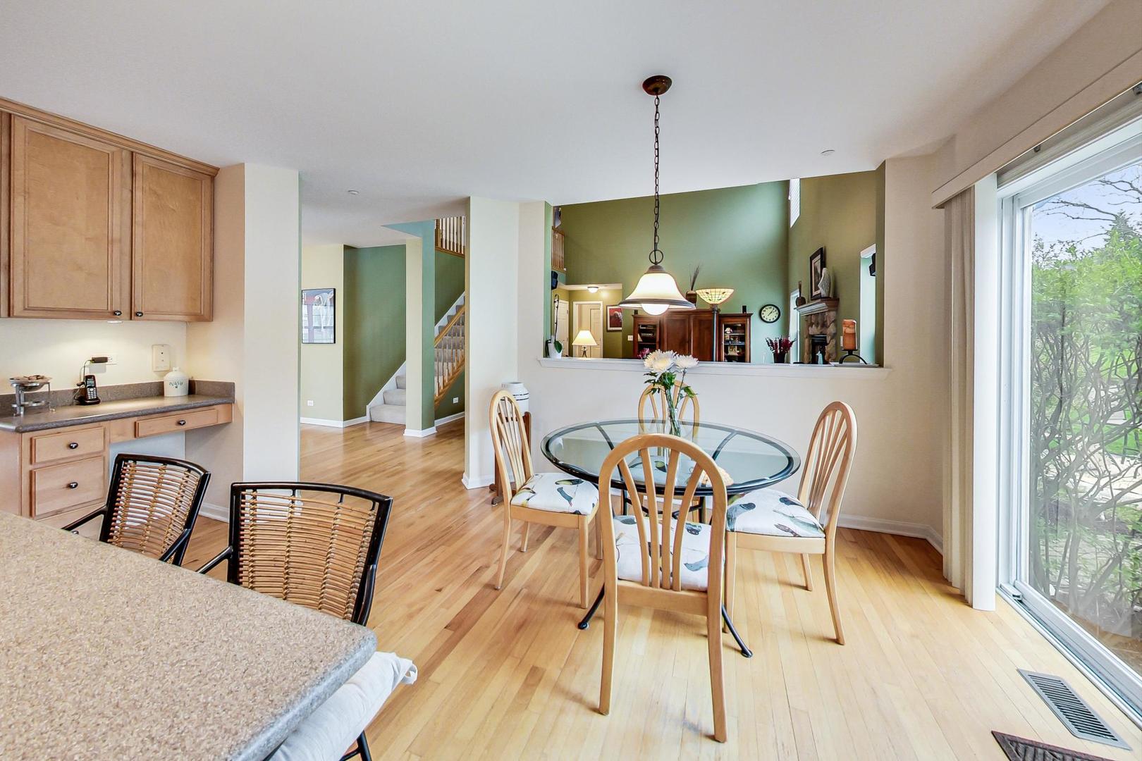 8052 Orchard Commons West Long Grove, IL 60060 - Photo 9 of 32 a view of a dining room with furniture window and outside view