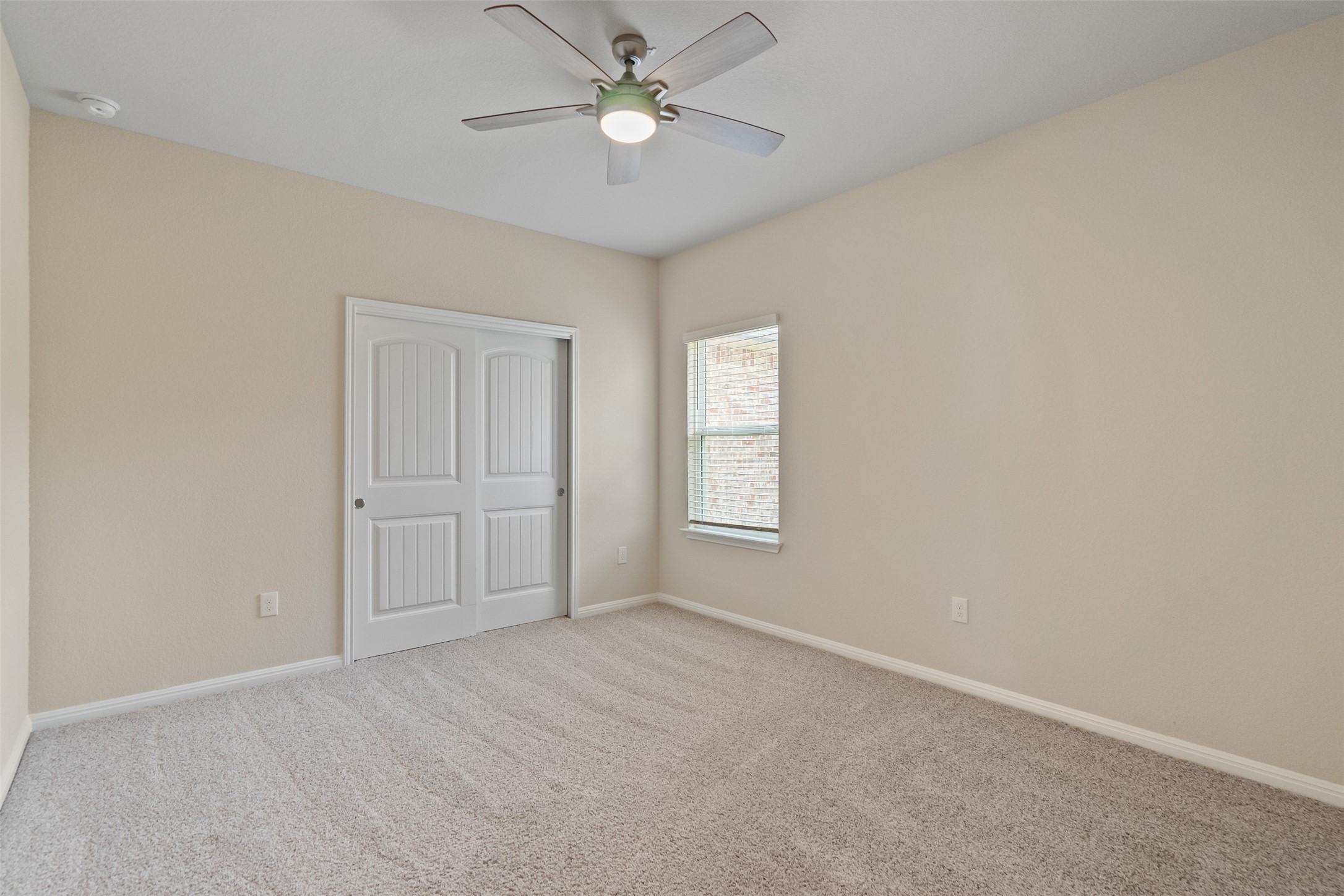 4125 Buffalo Ford Road Georgetown, TX 78628 - Photo 16 of 28 Unfurnished bedroom featuring carpet, a closet, and ceiling fan