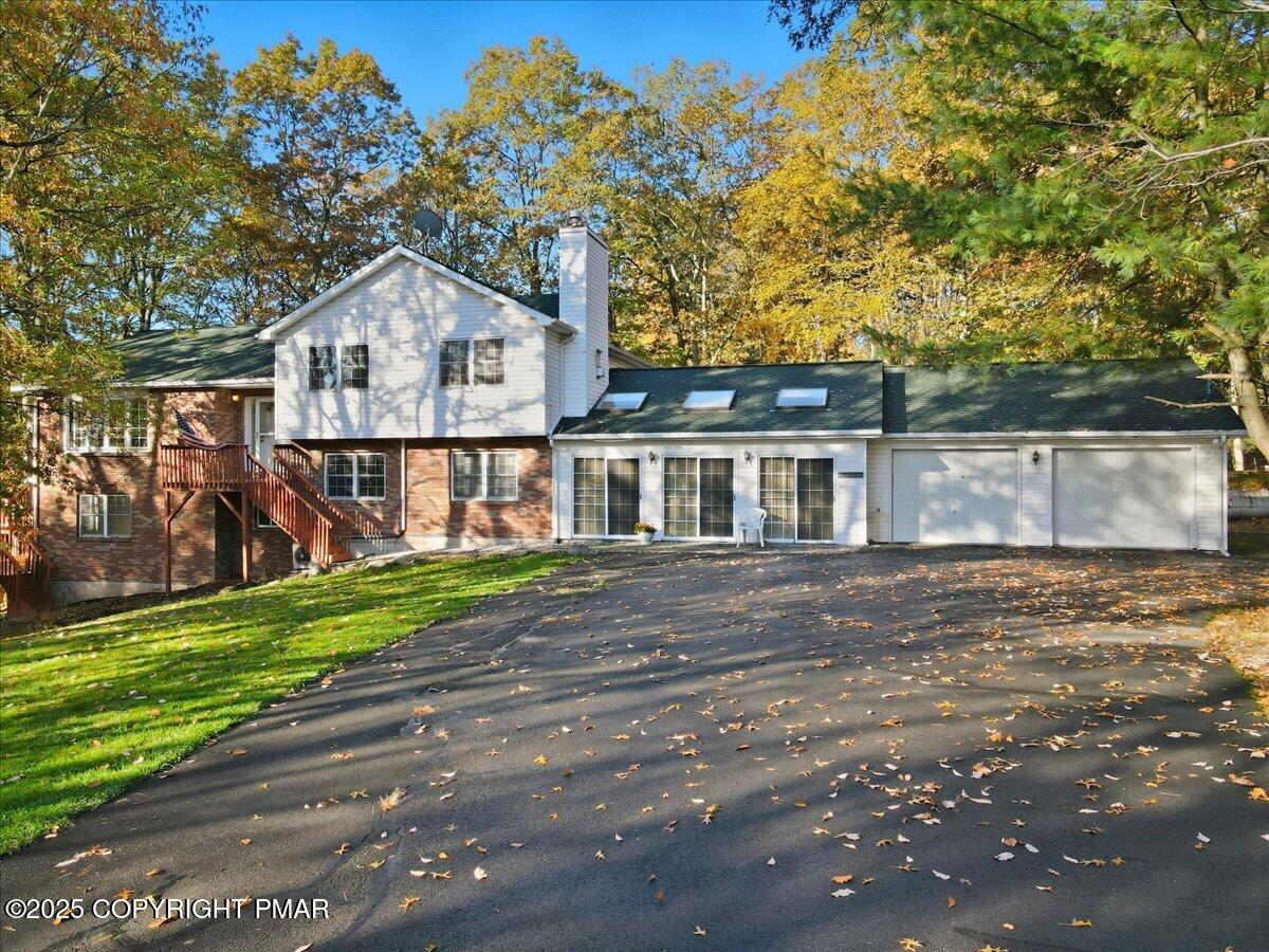349 Bumble Bee Pass Cresco, PA 18326 - Photo 1 of 109 a front view of a house with a yard