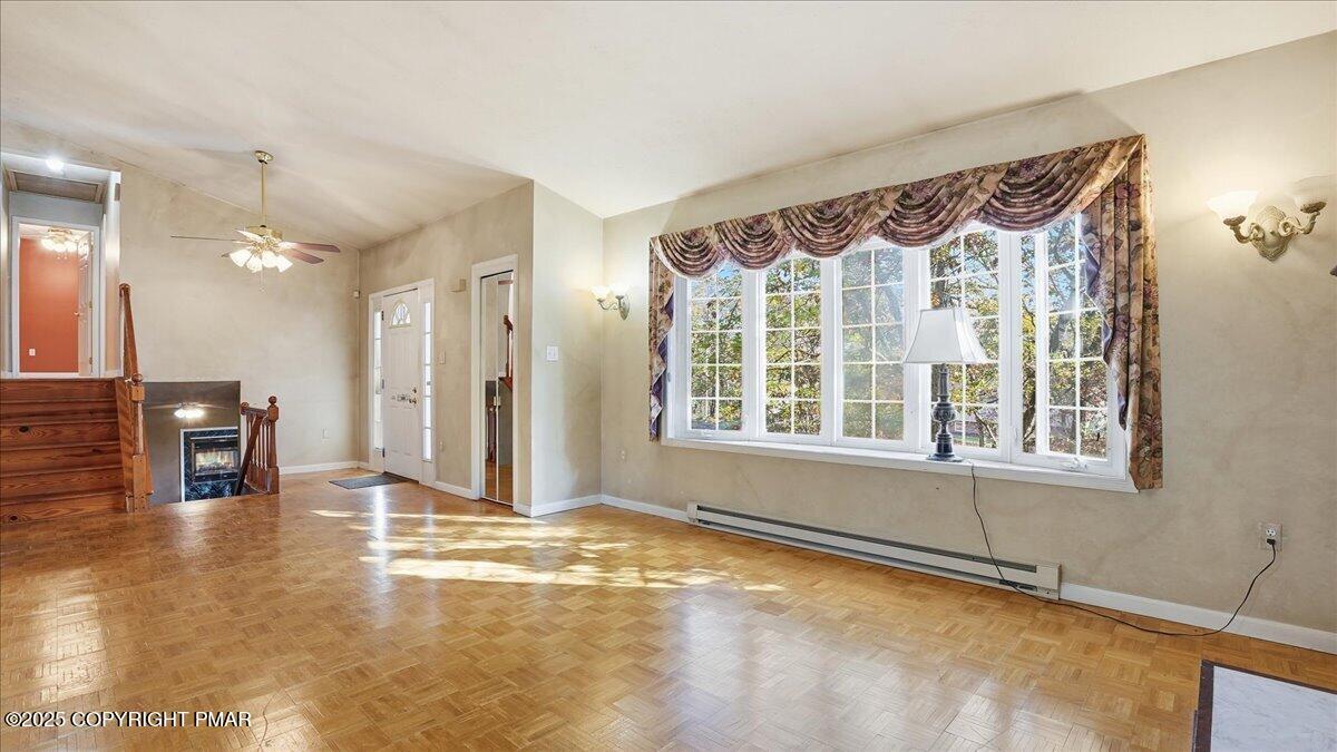 349 Bumble Bee Pass Cresco, PA 18326 - Photo 14 of 109 a view of an empty room with window and a kitchen