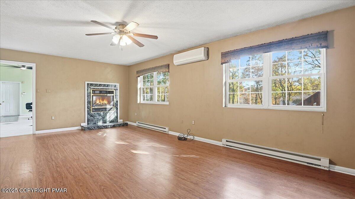 349 Bumble Bee Pass Cresco, PA 18326 - Photo 19 of 109 a view of an empty room with a window and wooden floor