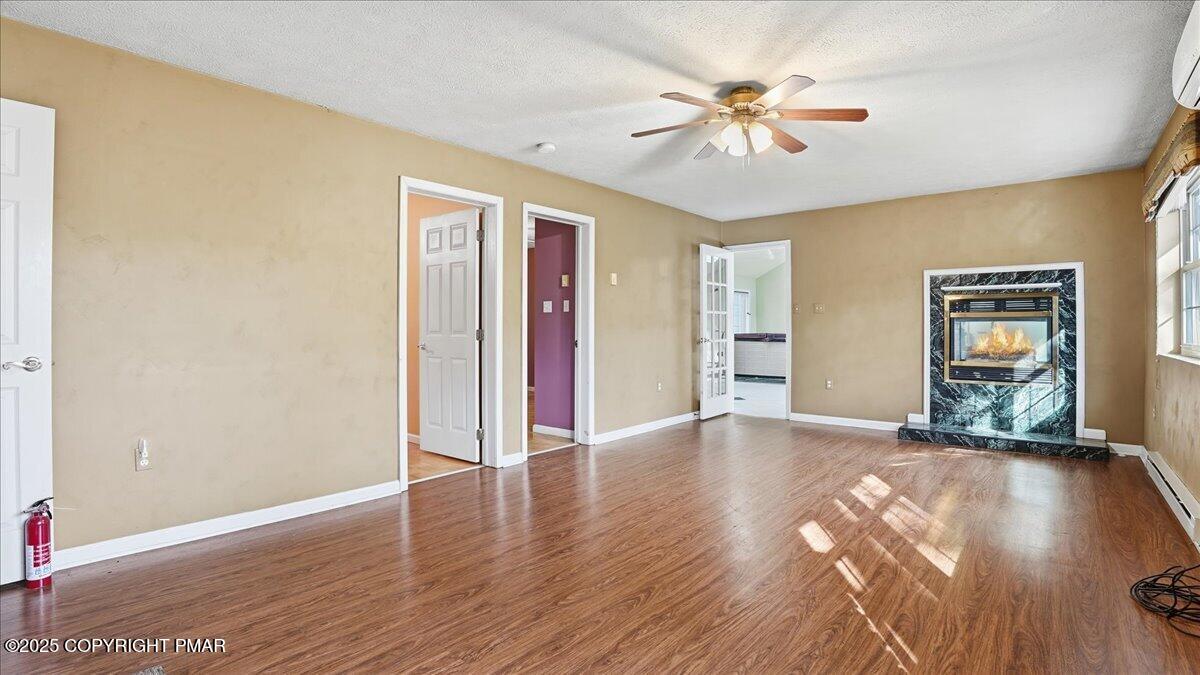 349 Bumble Bee Pass Cresco, PA 18326 - Photo 21 of 109 a view of an empty room with window and wooden floor