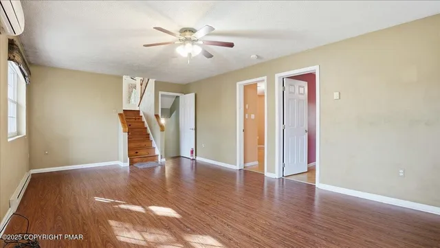 a room with gym equipment and view of living room