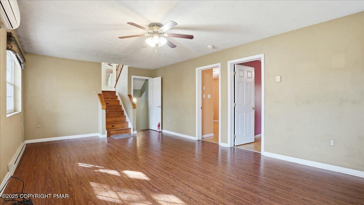 349 Bumble Bee Pass Cresco, PA 18326 - Photo 22 of 109 a view of an empty room with wooden floor and a window