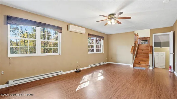 a room with gym equipment and large window