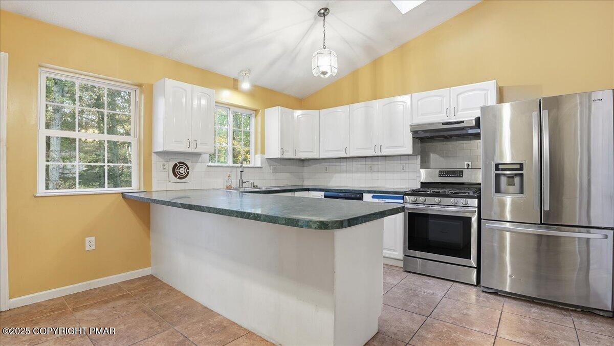 349 Bumble Bee Pass Cresco, PA 18326 - Photo 25 of 109 a kitchen with granite countertop a sink appliances cabinets and a counter top space