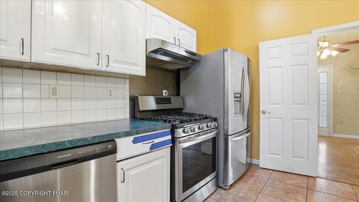 349 Bumble Bee Pass Cresco, PA 18326 - Photo 30 of 109 a kitchen with stainless steel appliances granite countertop a stove and a refrigerator