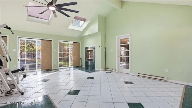 an empty room with windows and closet