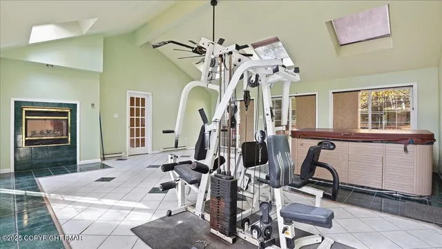 a bathroom with a bathtub and next to a window
