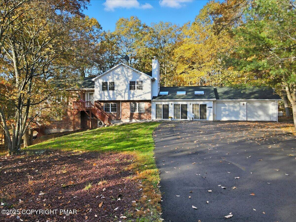 349 Bumble Bee Pass Cresco, PA 18326 - Photo 4 of 109 a front view of a house with a yard