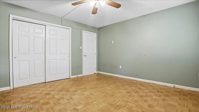 a balcony with wooden floor and fence