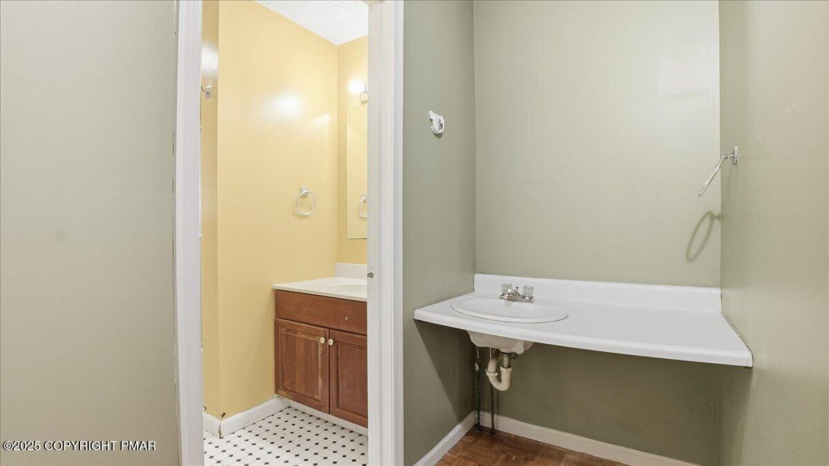 349 Bumble Bee Pass Cresco, PA 18326 - Photo 50 of 109 a bathroom with a sink a toilet and a mirror